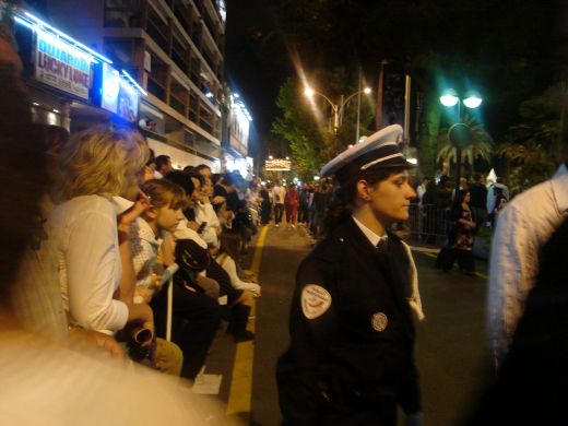 Crowds waiting for red carpet sightings, cop keeps control